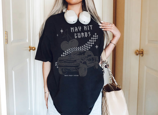 MAY HIT CURBS VINTAGE BLACK TEE WITH TRUCK, CHERRIES AND CHECKERED PRINT.